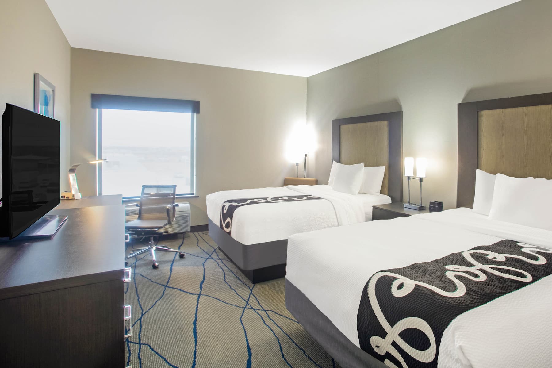 La Quinta Inn & Suites by Wyndham Ponca City Room Banner